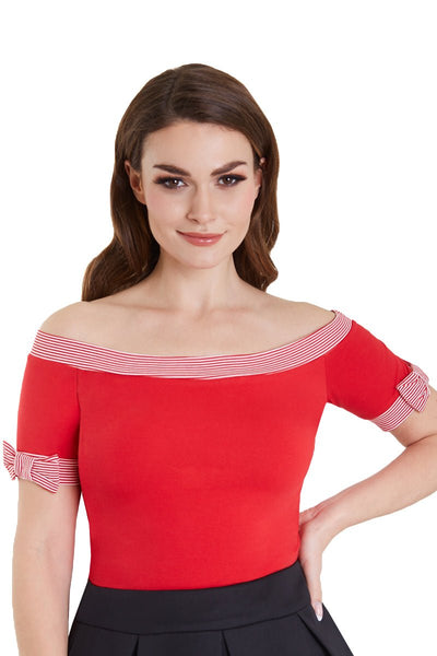 Model in red off shoulder top with short sleeves close up