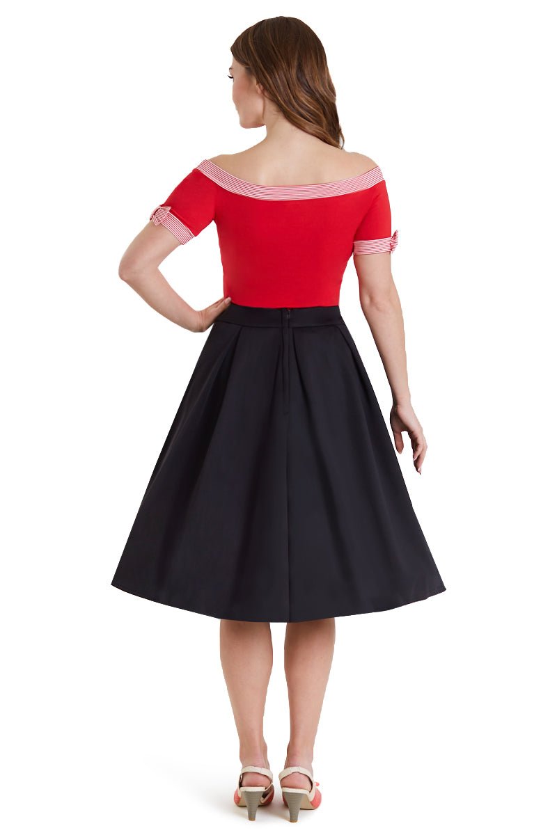 Model in red off shoulder top with short sleeves back view