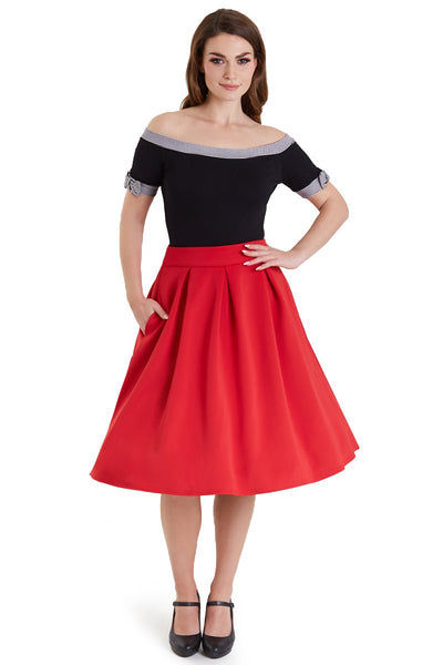 Model in off shoulder black top with striped trims
