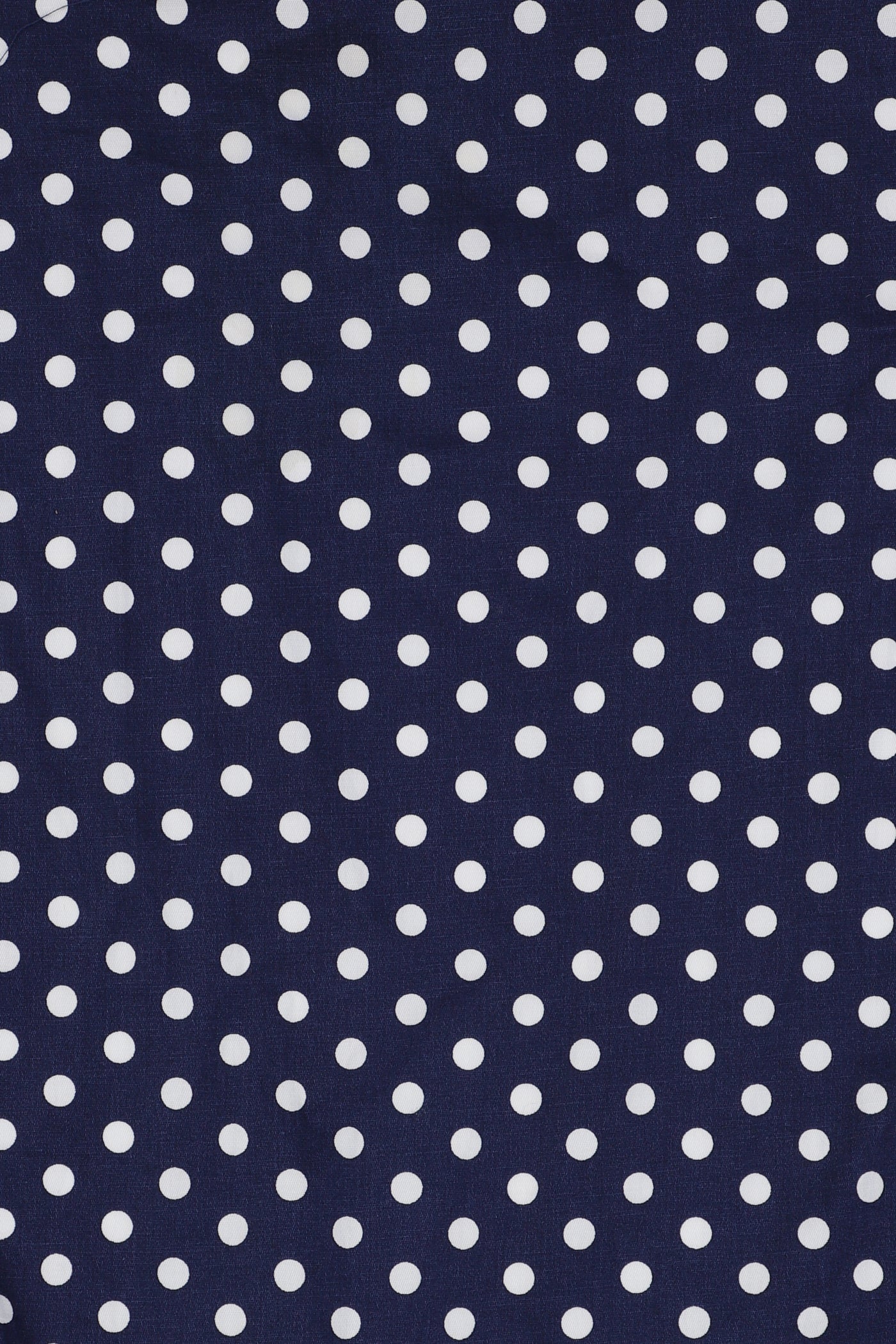 Navy blue fabric with white polka dots