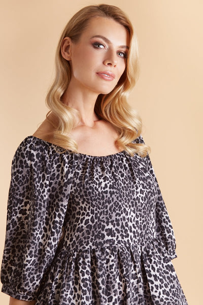 Model in sleeved casual dress in leopard print close up