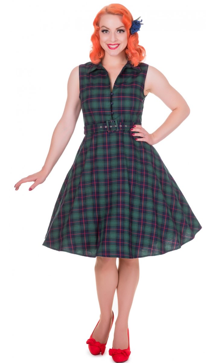 Model wears our sleeveless Poppy button up dress in green tartan print, front view