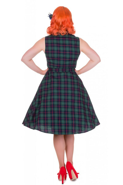 Model wears our sleeveless Poppy button up dress in green tartan print, back view