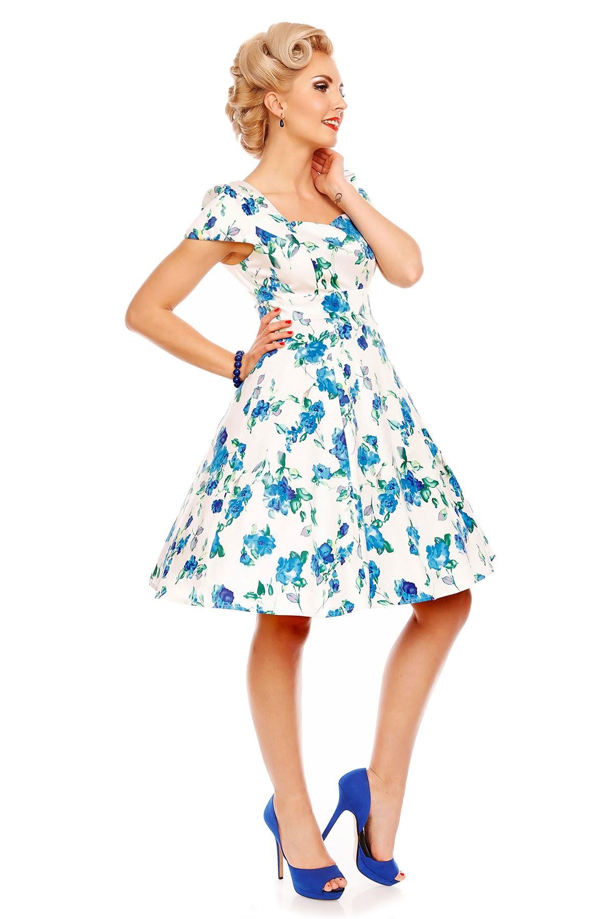 Model wearing white/blue floral dress side view