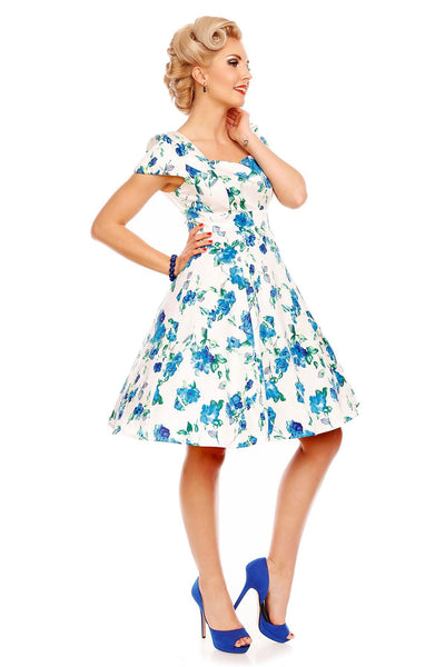 Model wearing white/blue floral dress side view