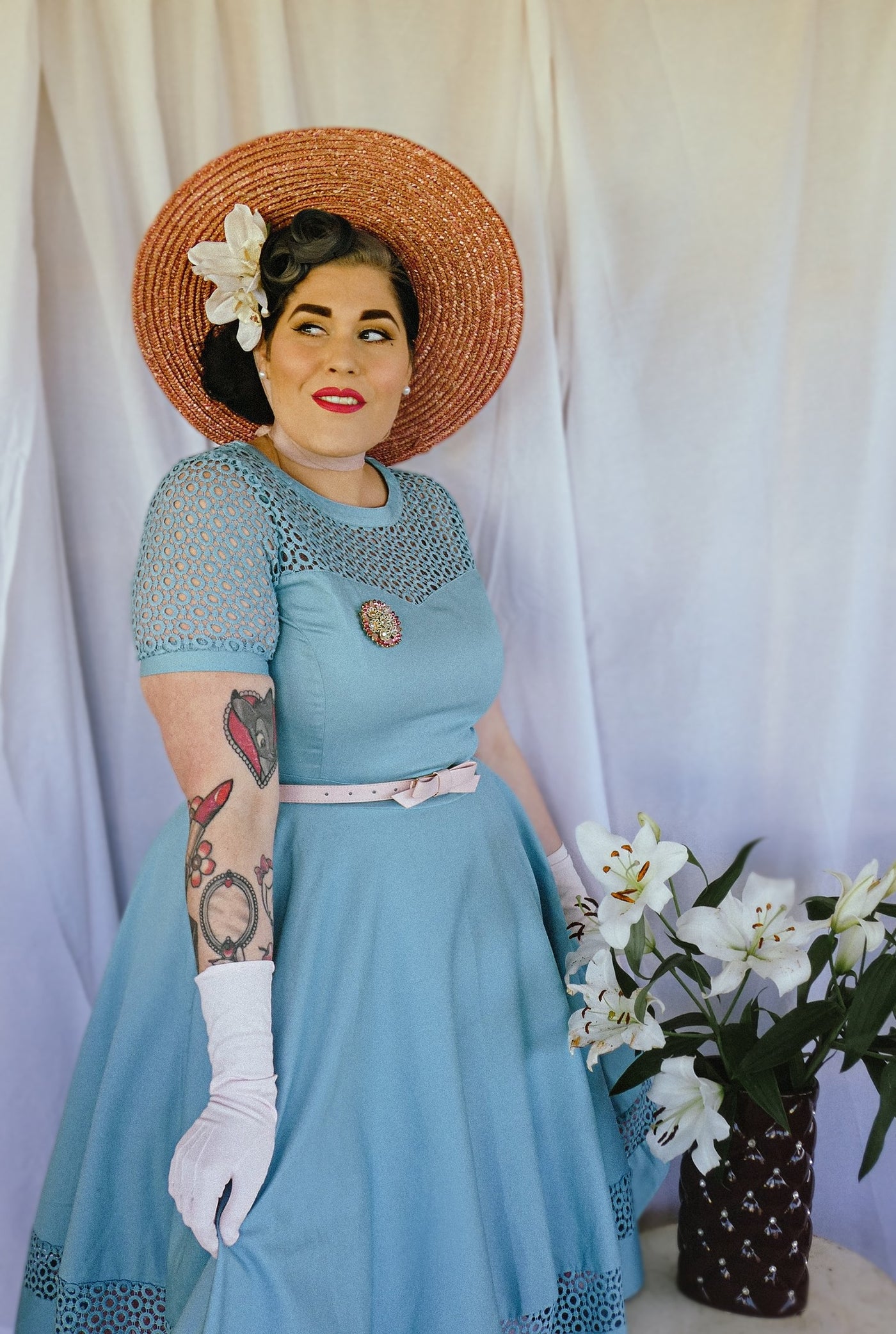 Customer wears our short sleeved dress in plain baby blue, with white accessories