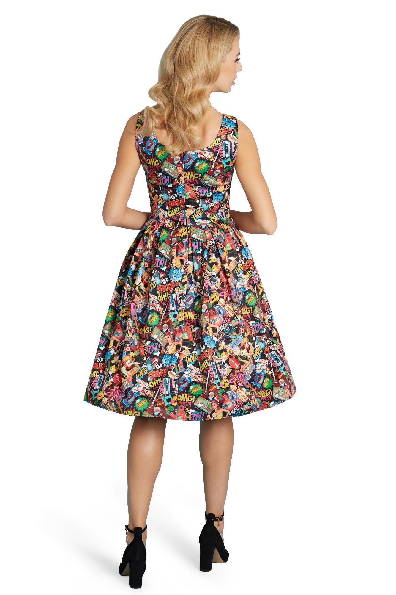 Model wears our Amanda swing dress, in colourful pop art comic print, back view
