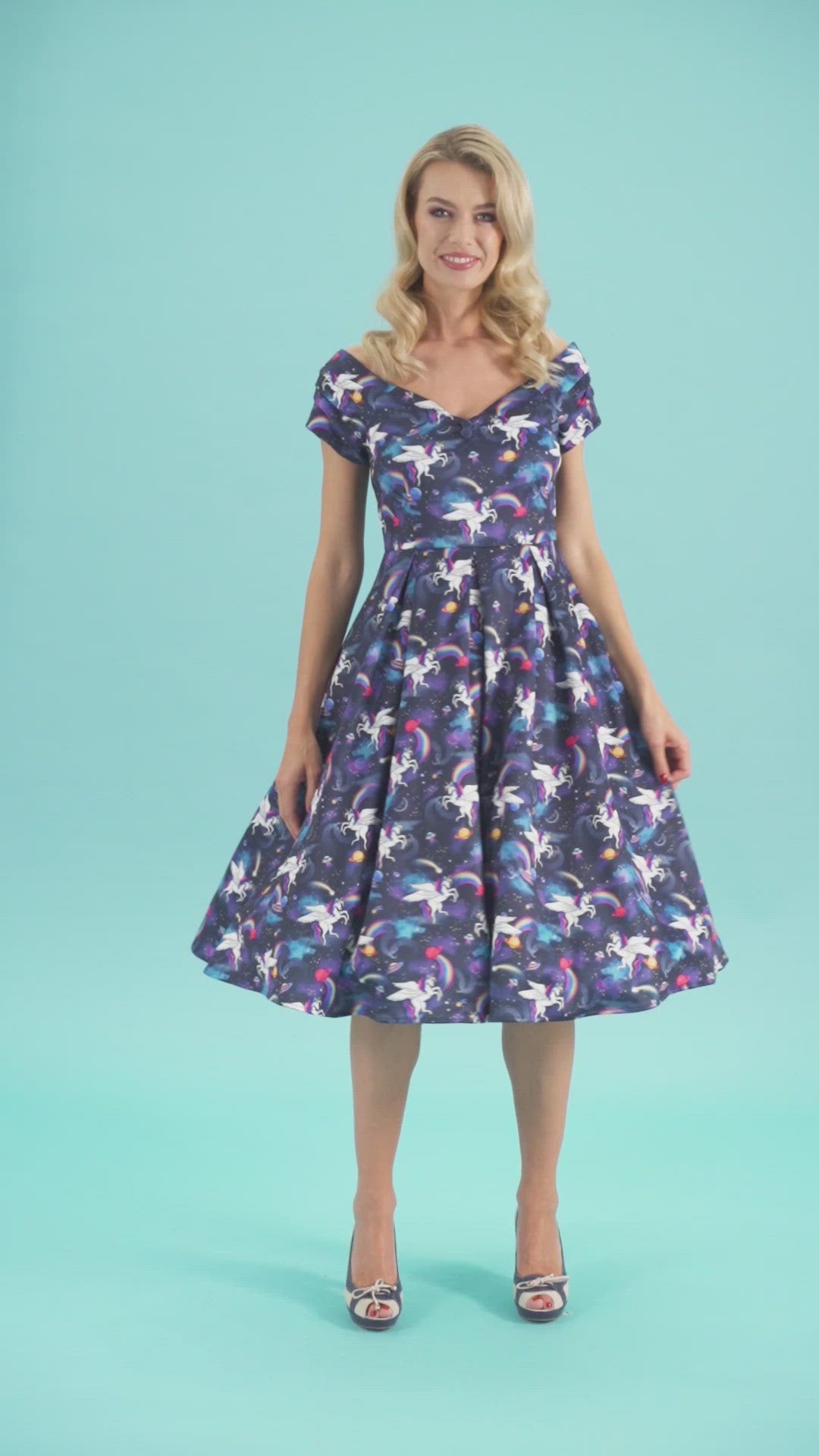 Video of a model twirling, wearing our Lily Retro Off Shoulder Unicorn Swing Dress.