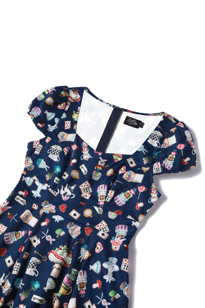 Close up view of Alice In Wonderland Print Sleeved Dress in Navy Blue