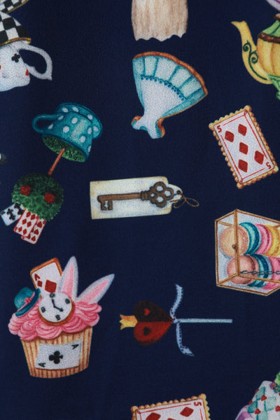 Close up view of Alice In Wonderland Print Sleeved Dress in Navy Blue