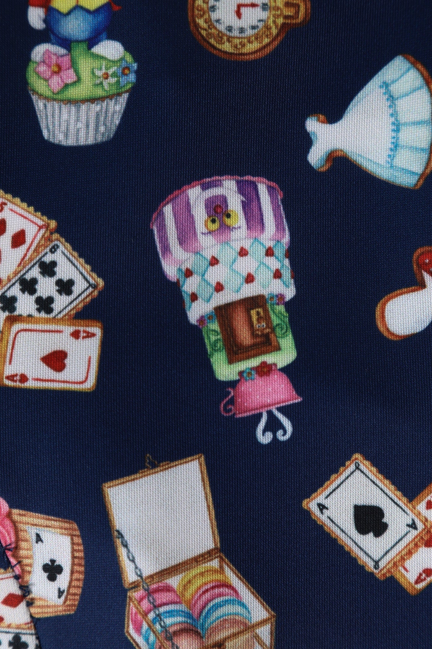 Close up view of Alice In Wonderland Print Sleeved Dress in Navy Blue