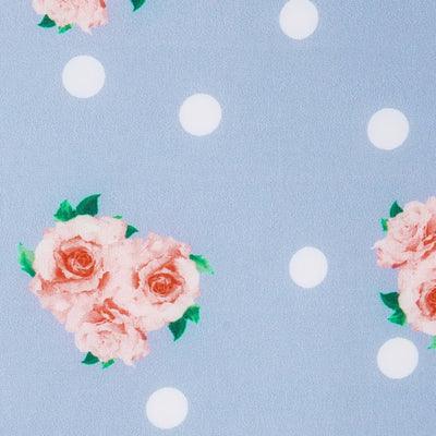 light blue fabric swatch with white spots and pink flowers
