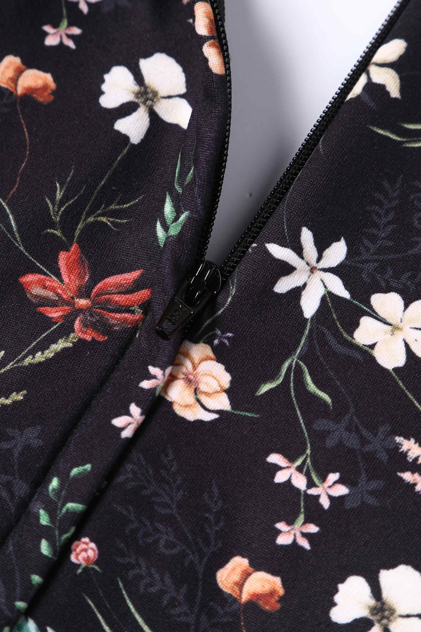 Close up View of Black Meadow Floral Short Sleeved Jumpsuit