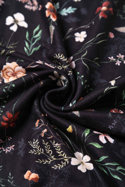Close up View of Black Meadow Floral Short Sleeved Jumpsuit
