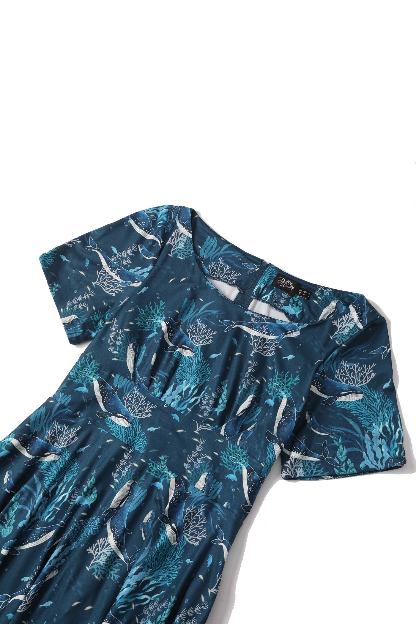 Close up view of blue whale print sleeved swing dress in blue