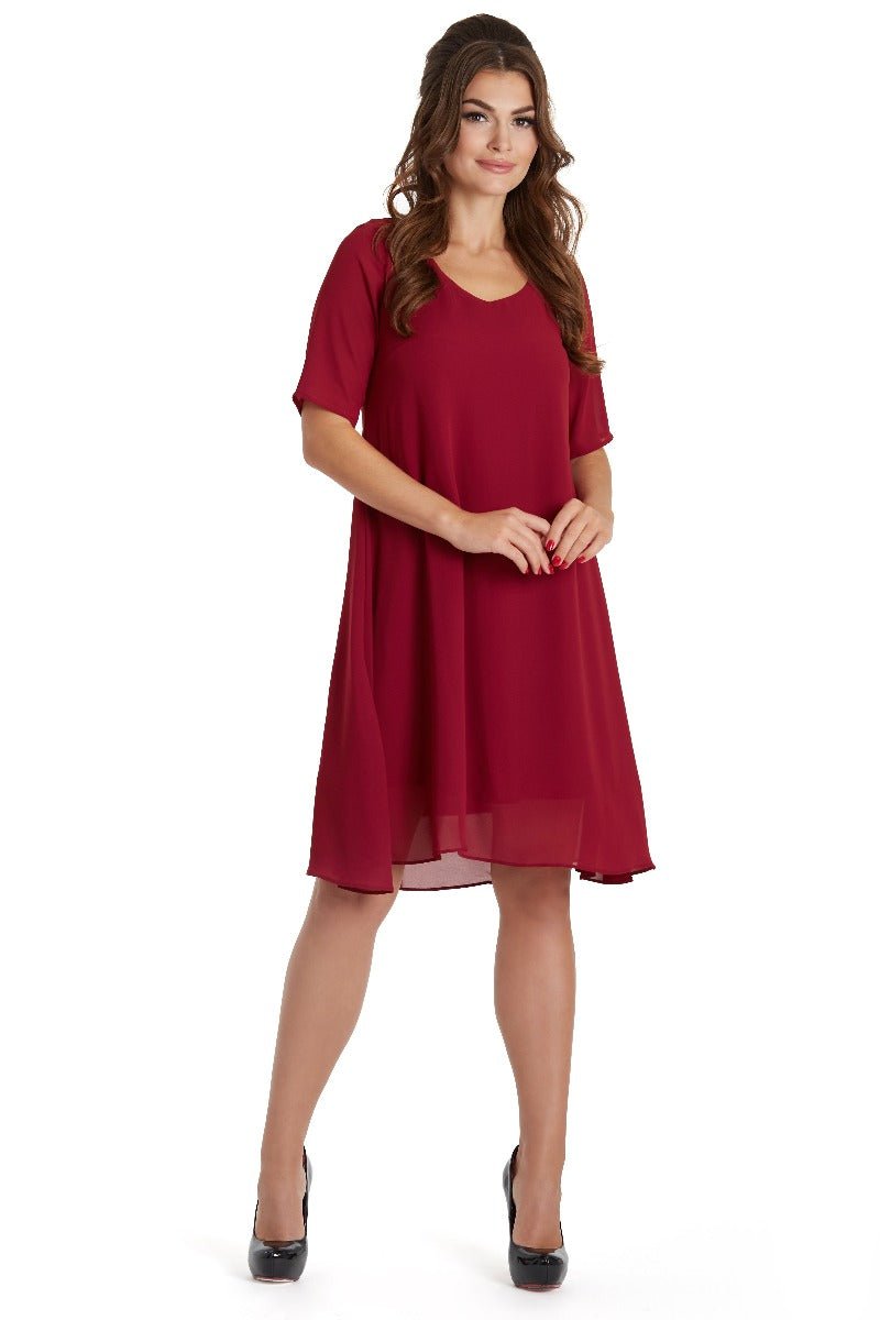 Model wears our Dora summer day casual dress in burgundy red, front view