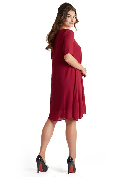 Model wears our Dora summer day casual dress in burgundy red, side view