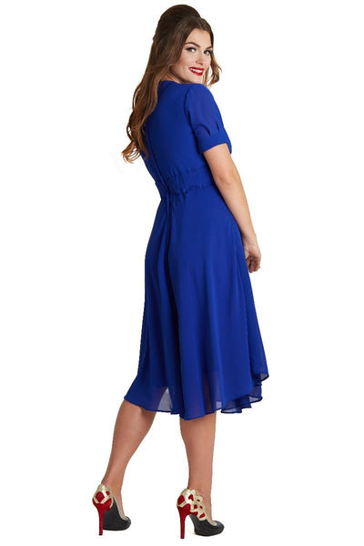 Model wearing our Elise 40's casual day dress, in dark blue, back view