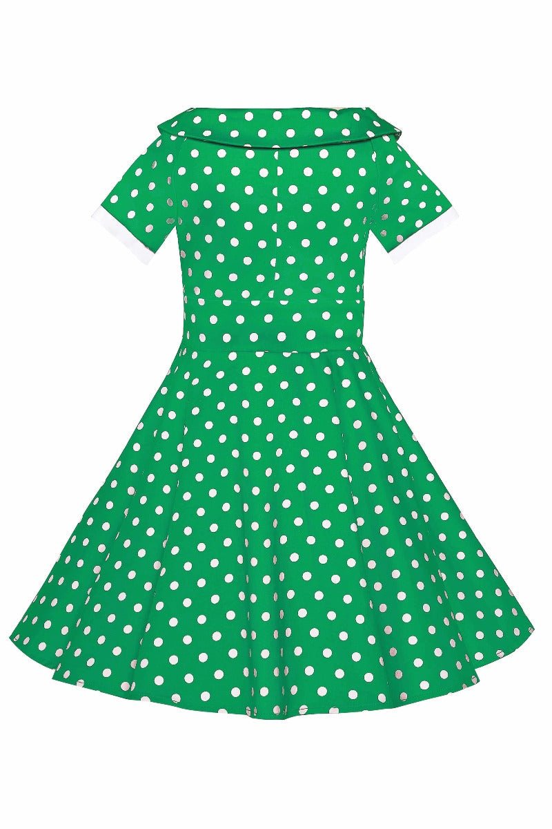 Back view of girls Darlene dress in dark green polka dot print
