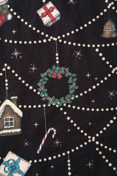 Close up view of Christmas Print Long Sleeved Dress in Black