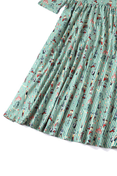 Close up View of Circus Print with Stripes Long Sleeved Swing Dress in Green