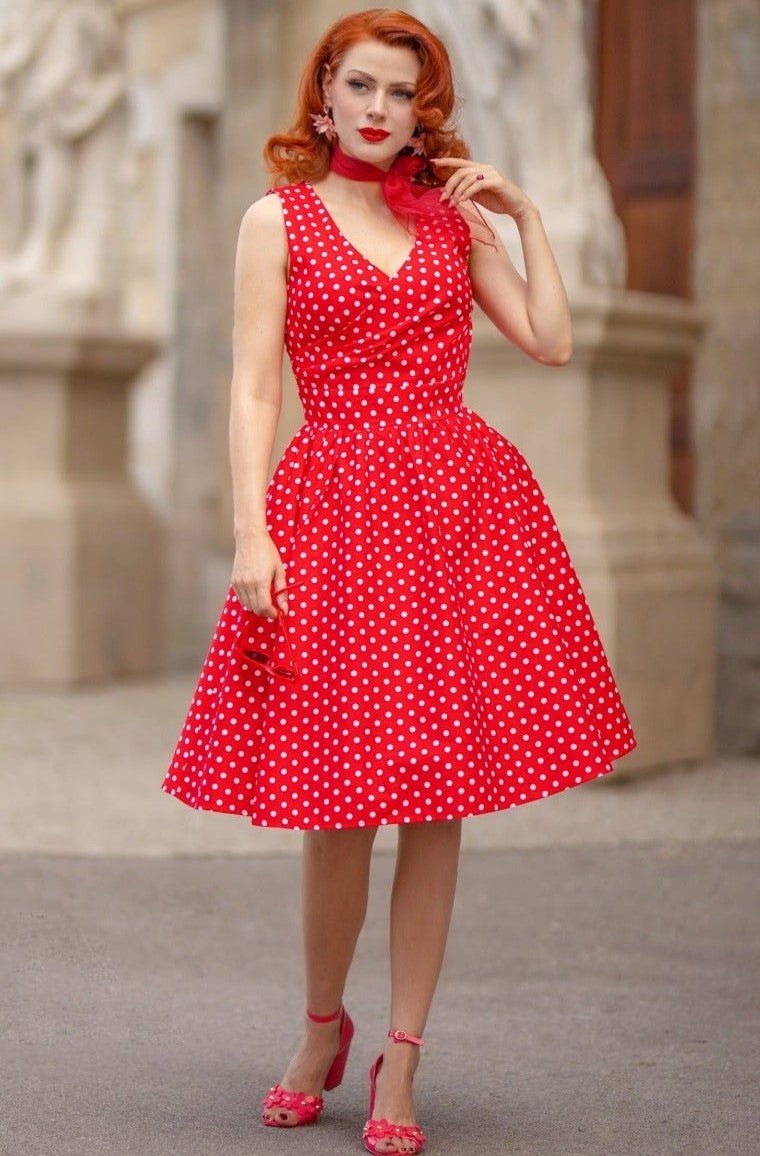 Model wearing our May crossover bust dress, in red/white polka dot print