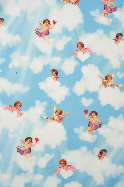 Close up View of Cupid Print Swing Dress in Light Blue