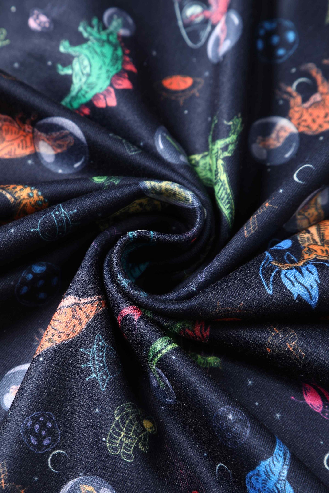 Close up view of Dinosaur In Space Long-Sleeved Dress in Navy Blue