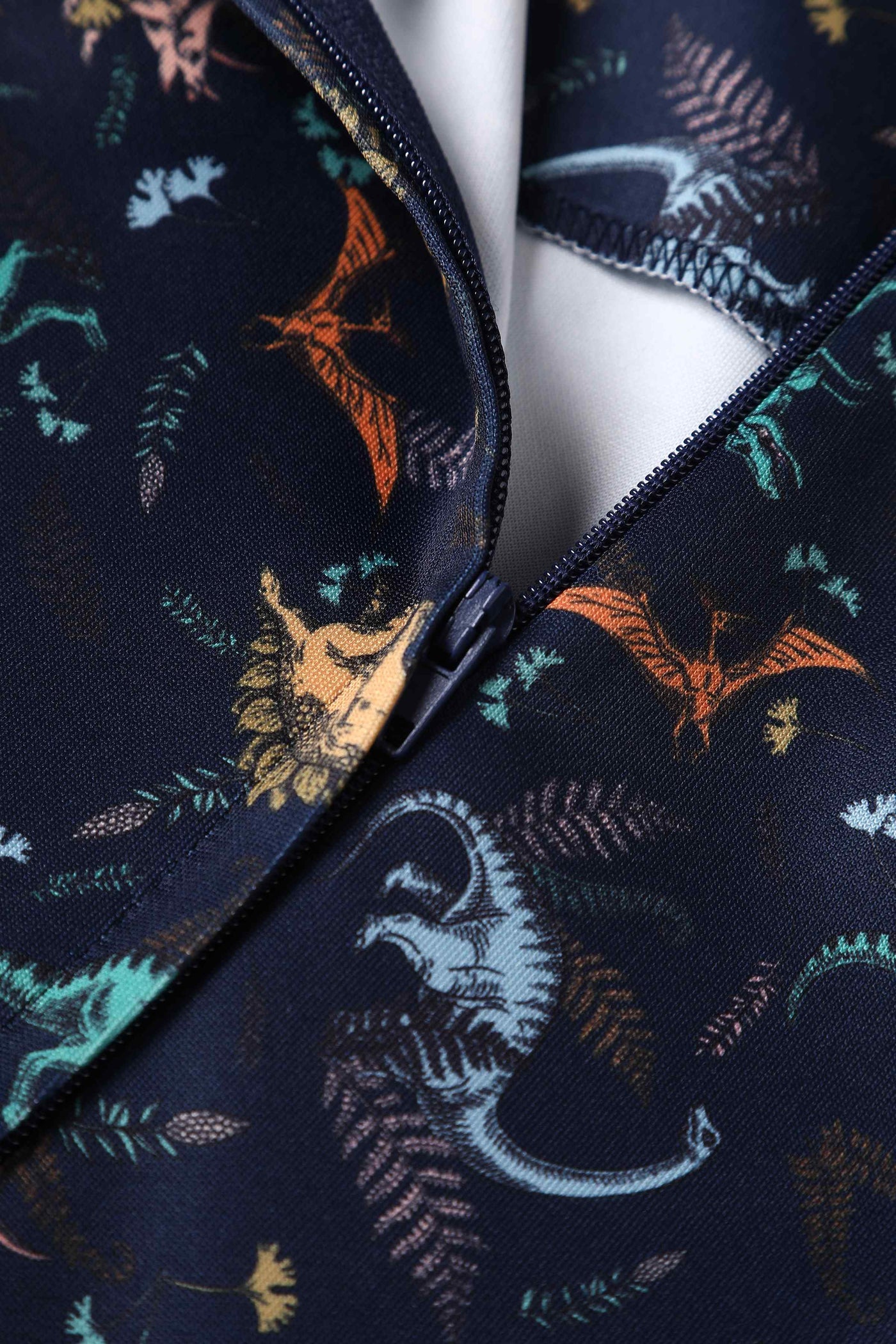 Close up view of Multi-coloured Dinosaurs in Navy Blue Flared Dress