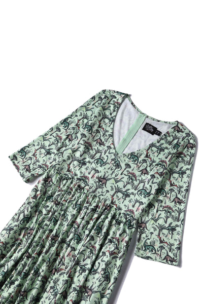 Close up view of Dinosaur Print Long-Sleeved Dress in Light Green