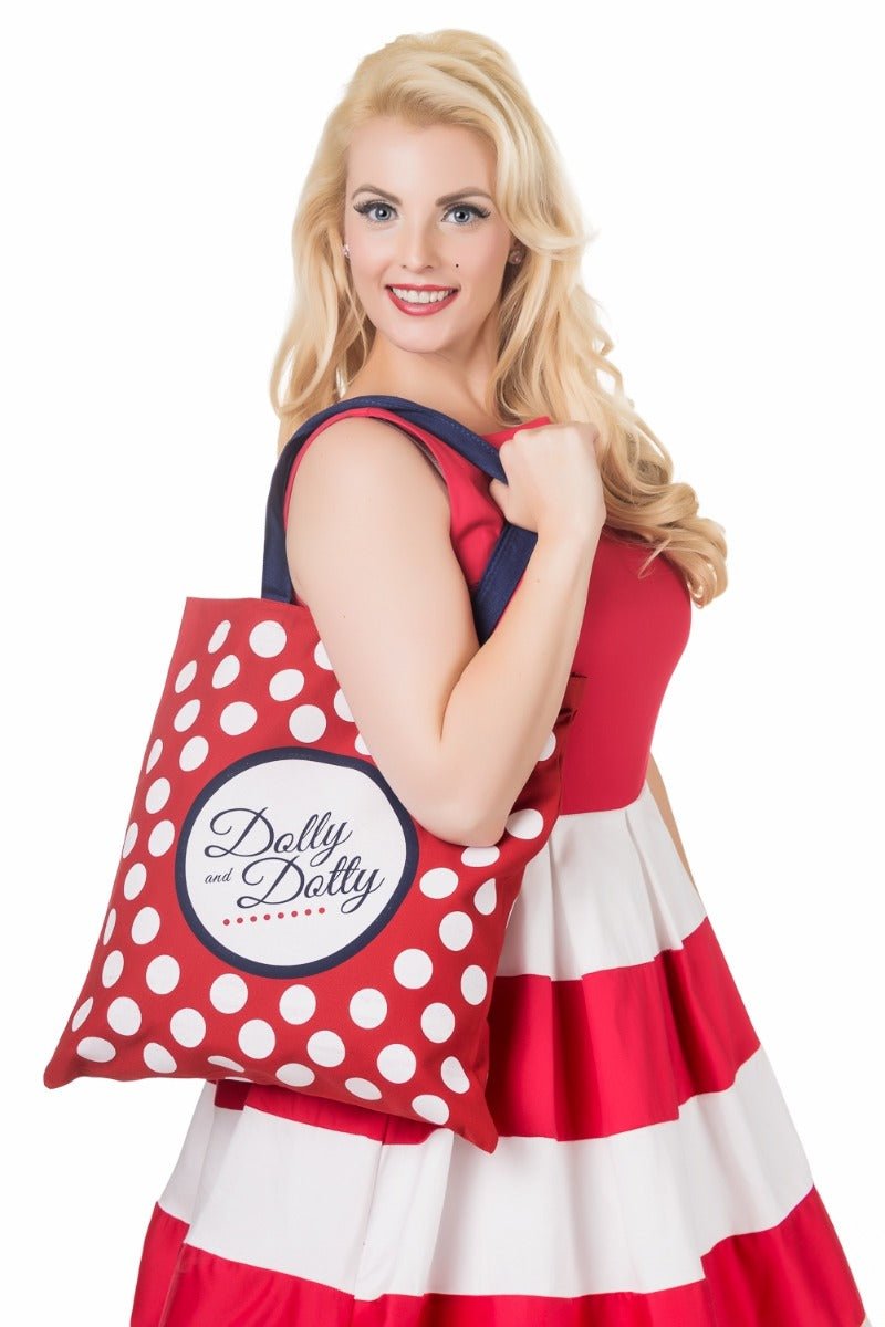 Model wearing a red and white striped dress, with a Dolly and Dotty tote bag on her shoulder