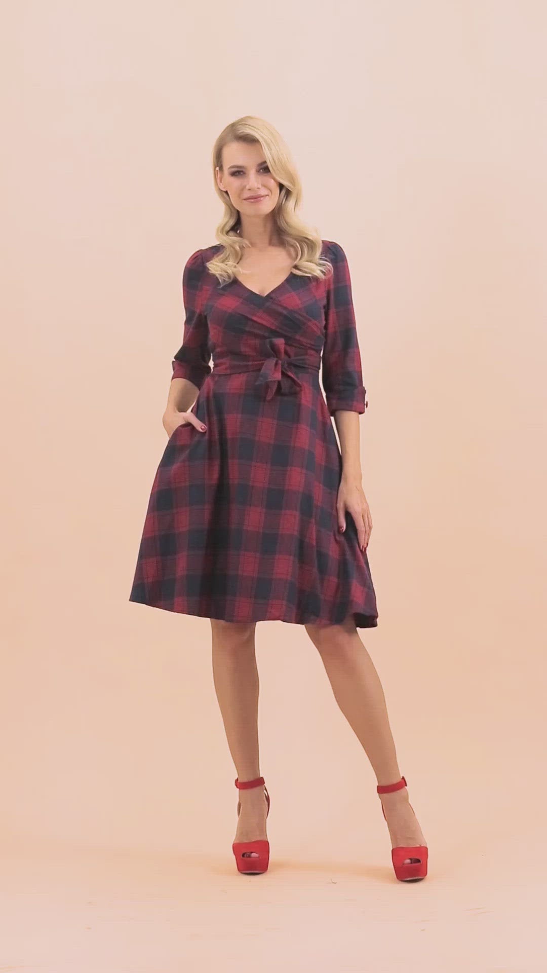 Video of model posing wearing red blue tartan sleeved dress