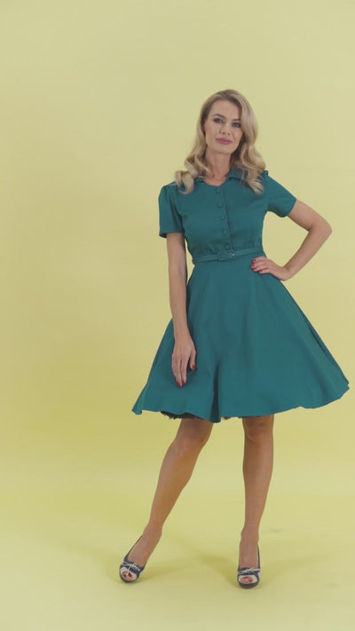Video of a model wearing our Penelope 1950s Inspired Blue Shirt Dress.