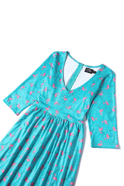 Close up view of Flamingo Long Sleeved Dress in Green