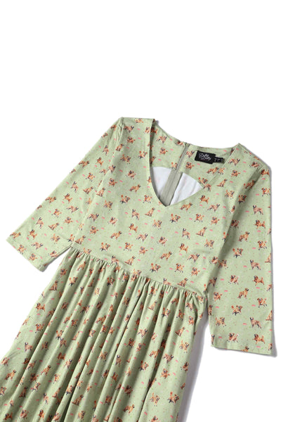 Close up View of Golden Retriever Print Long Sleeved Swing Dress in Green