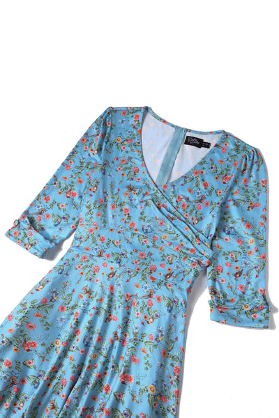 Close up view of Hummingbird Print Long Sleeved Dress in Blue