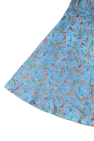 Close up view of Hummingbird Print Long Sleeved Dress in Blue