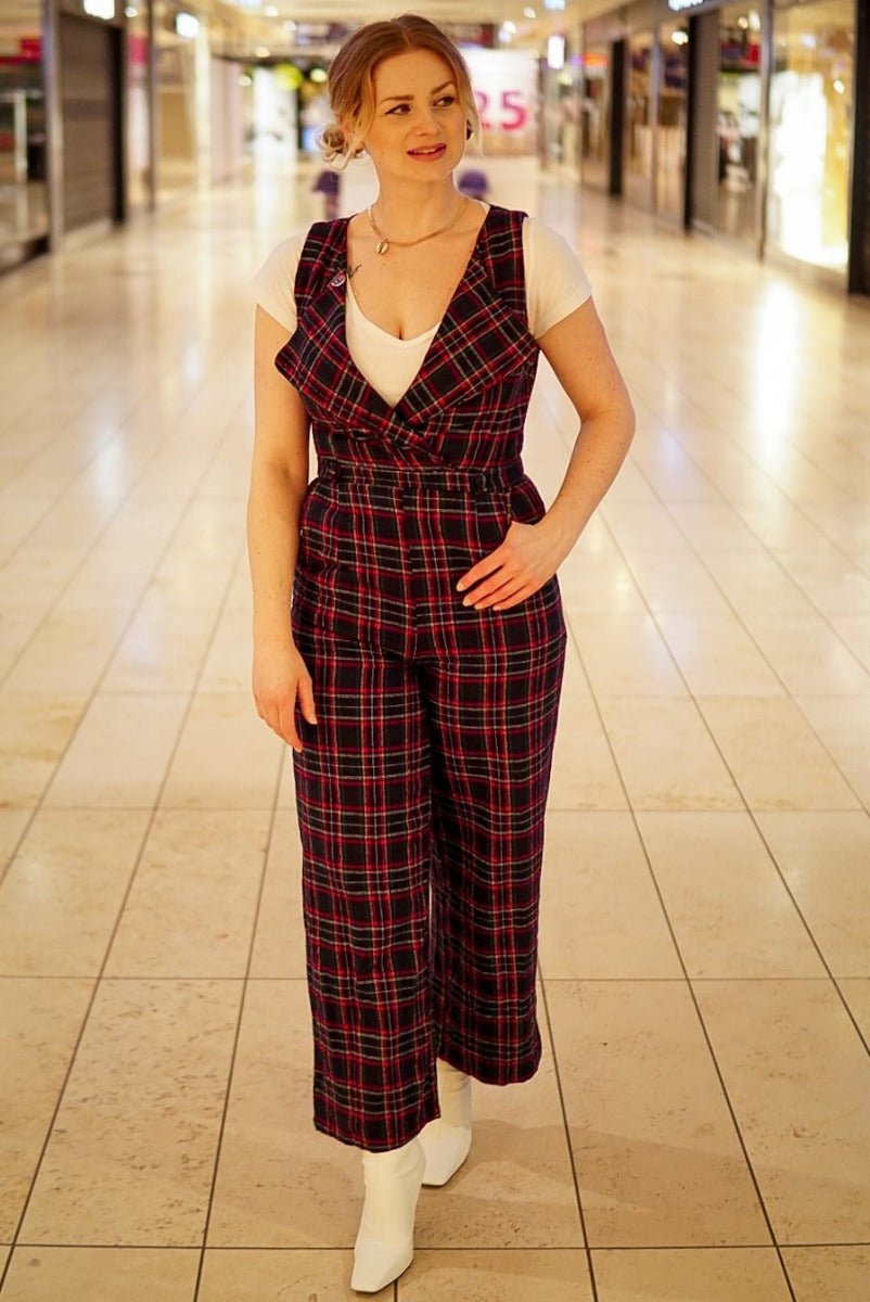 Influencer wearing blue red tartan jumpsuit