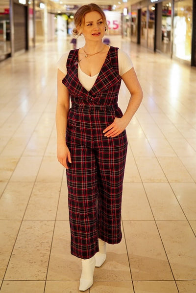 Influencer wearing blue red tartan jumpsuit