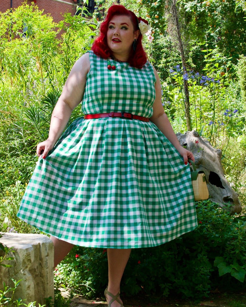 Blogger wearing green white gingham check print dress with accessories