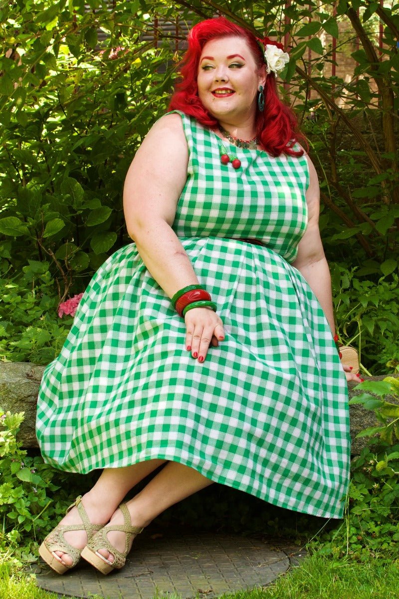 Blogger wearing green white gingham check print dress with accessories