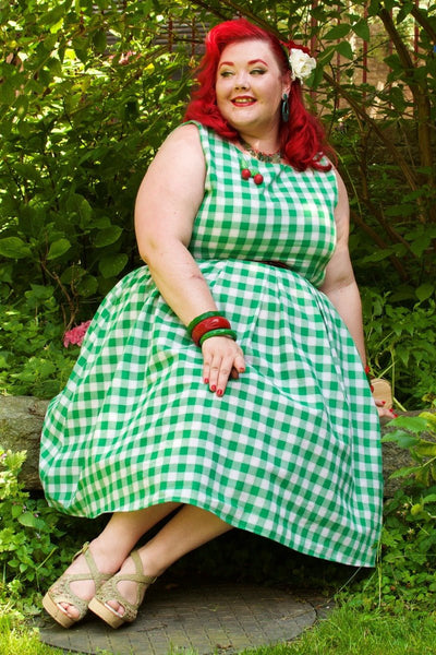 Blogger wearing green white gingham check print dress with accessories