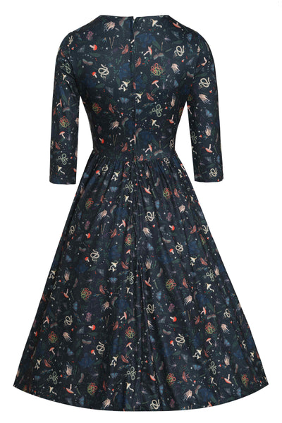 Back view of Mystical Forest Print Dress in Dark Green
