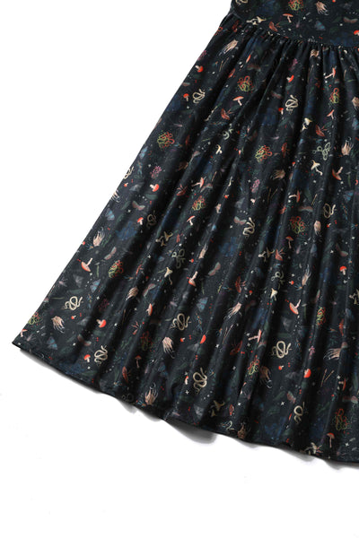 Close up view of Mystical Forest Print Dress in Dark Green