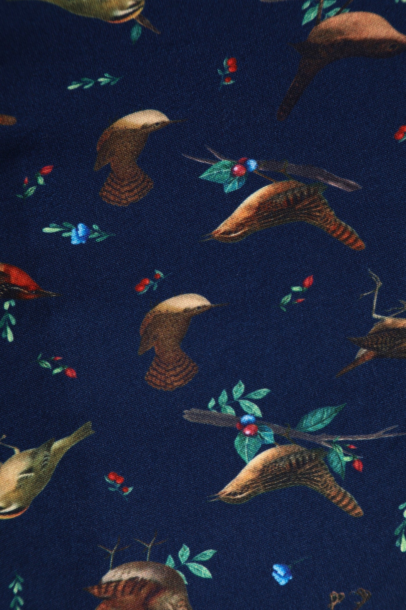 Close up view of navy blue bird print sleeved swing dress