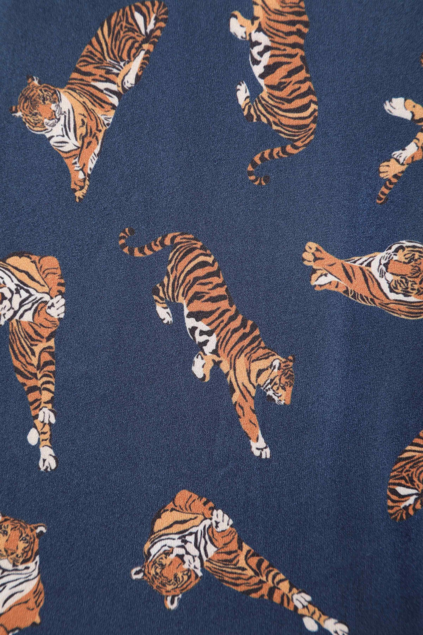 Close up view of Navy Blue Tiger Print Wrap Dress