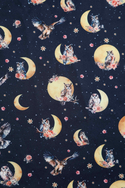 Close up View of Night Owl Print Sleeveless Swing Dress in Navy Blue