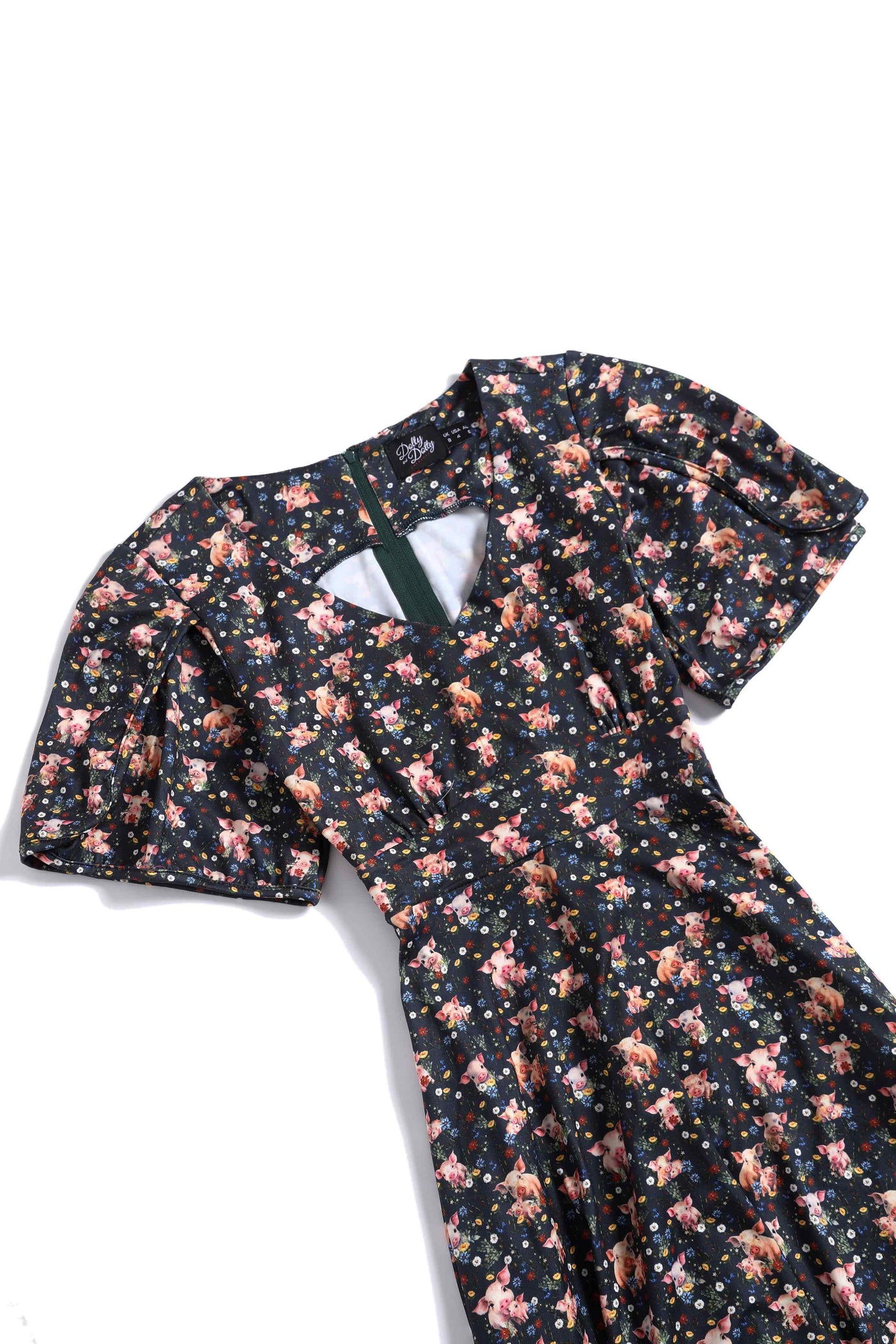 Close up view of Pig Print Petal Sleeved Dress in Black