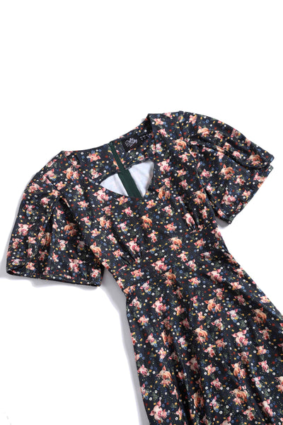 Close up view of Pig Print Petal Sleeved Dress in Black