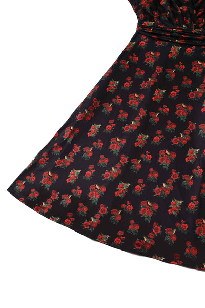 Close up View of Red Rose Print Crossover Bust Dress in Black